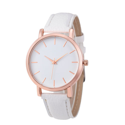 Wristwatch with white strap and rose gold case on a white background