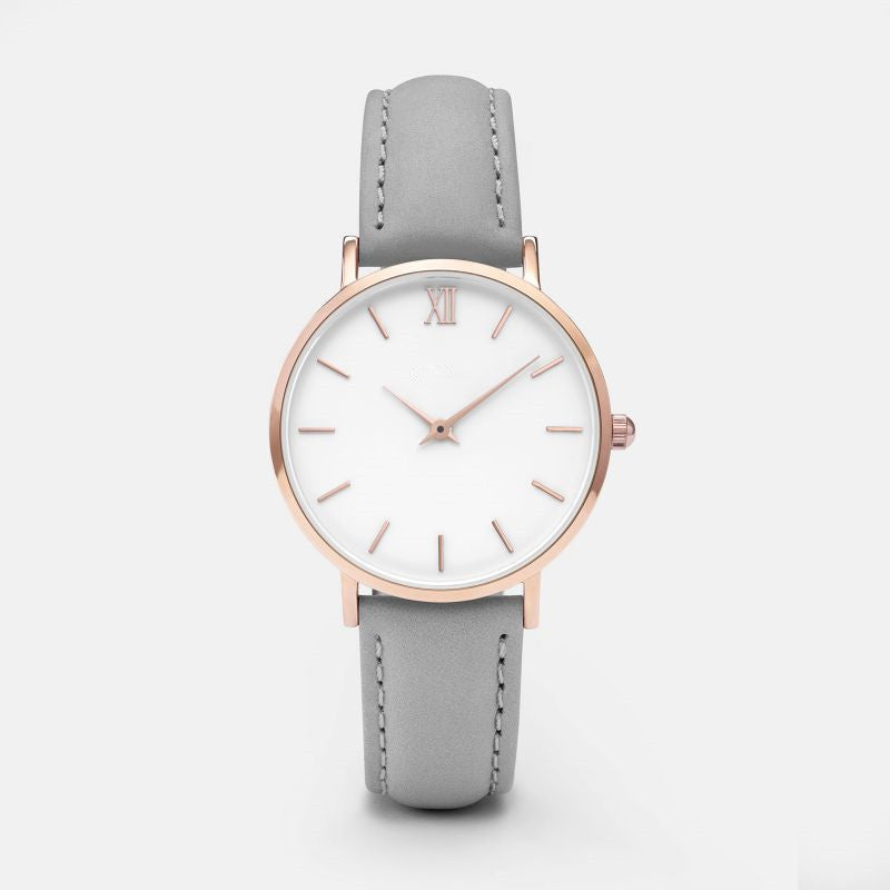Wristwatch with white strap and rose gold case on a white 2