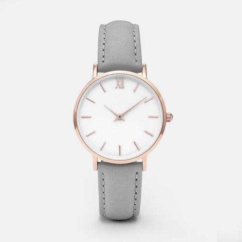 Wristwatch with white strap and rose gold case on a white 2